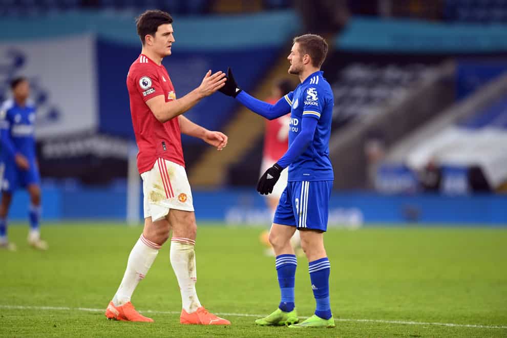 Manchester United’s Harry Maguire and Leicester City’s Jamie Vardy (right) shake hands