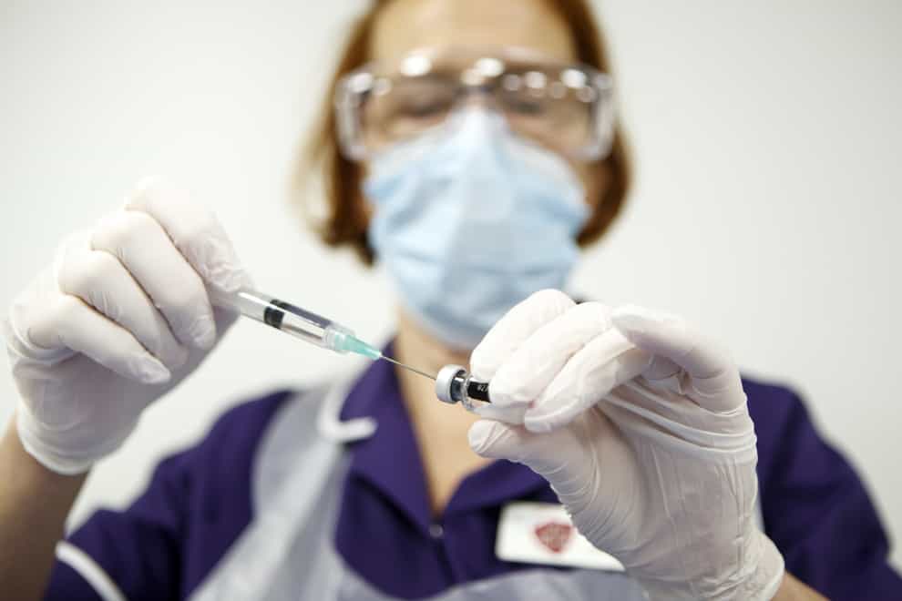 Nurse Pat Sugden prepares the Pfizer-BioNTech vaccine at the Thackray Museum of Medicine in Leeds