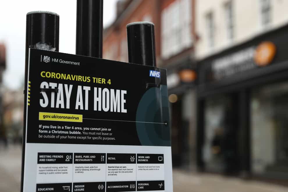 A Government coronavirus Tier 4 sign on the High street in Winchester, Hampshire