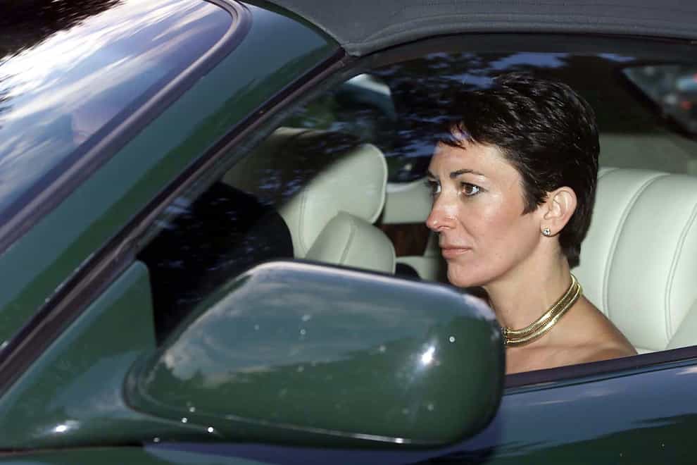 Ghislaine Maxwell sits in the front passenger seat of a car