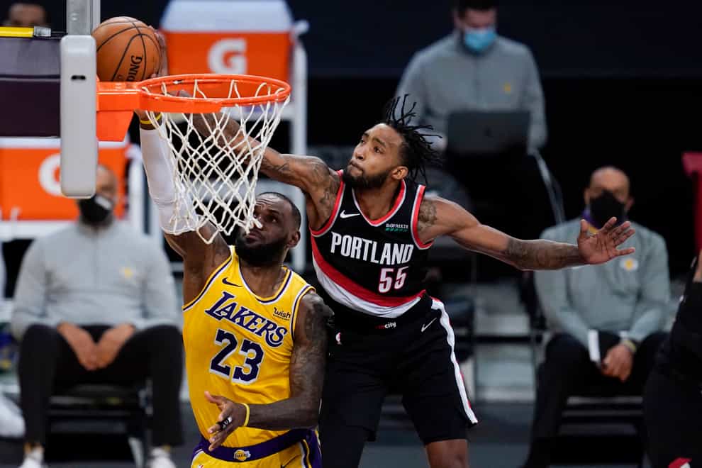 Portland Trail Blazers forward Derrick Jones Jr blocks a shot by Los Angeles Lakers forward LeBron James