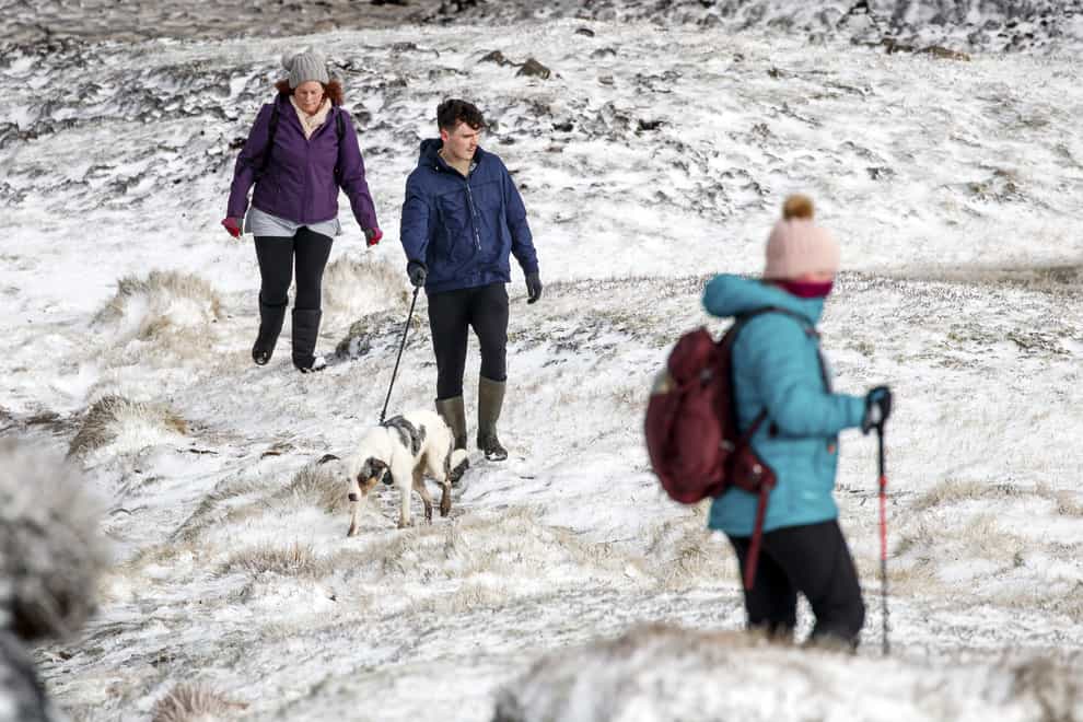 Hikers in snow in Derbyshire