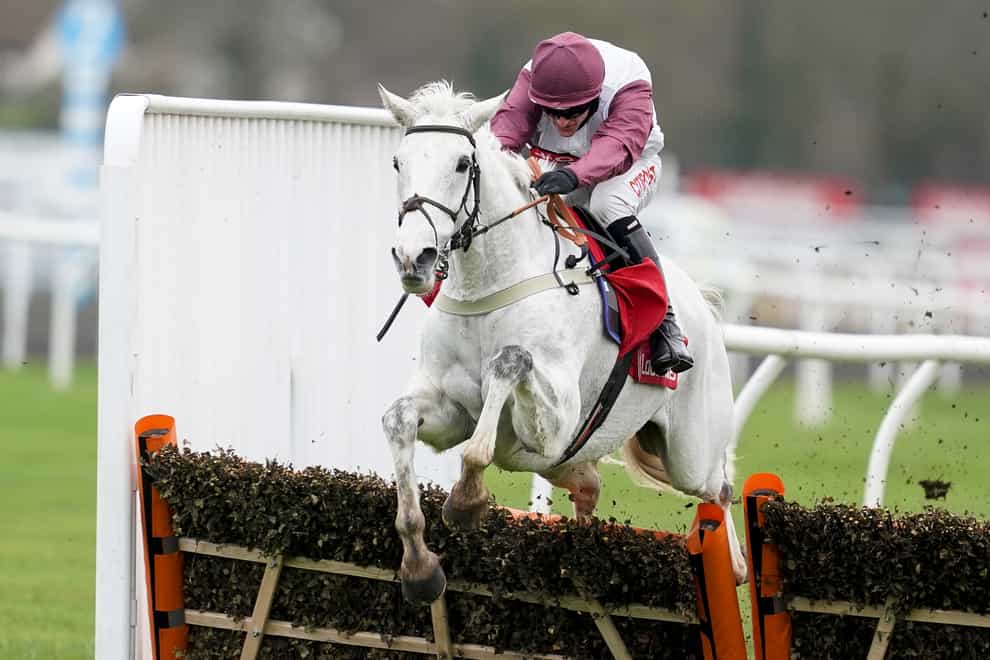 Adam Wedge and Silver Streak clear the last to win the Ladbrokes Christmas Hurdle