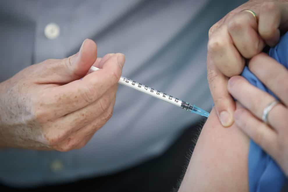 A person receives the Pfizer-BioNTech vaccine
