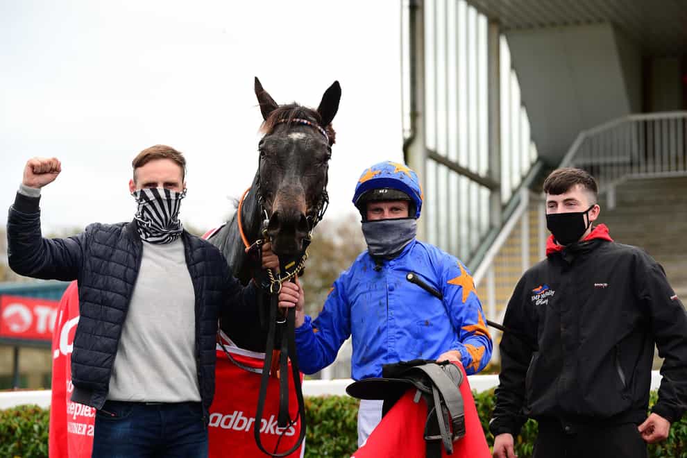 The Jam Man and Paul Townend celebrate winning The Ladbrokes Troytown Handicap Steeplechase with owner and trainer Ronan McNally and son Tiernan (right) at Navan Racecourse