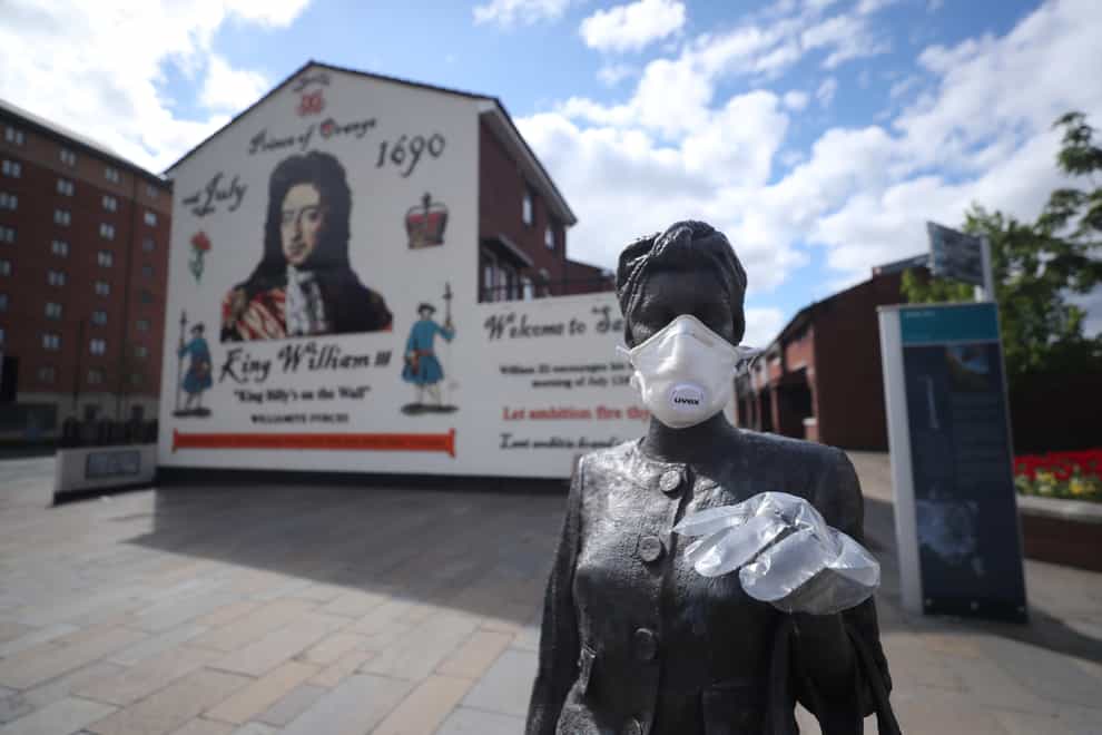 A statue wearing PPE in Belfast