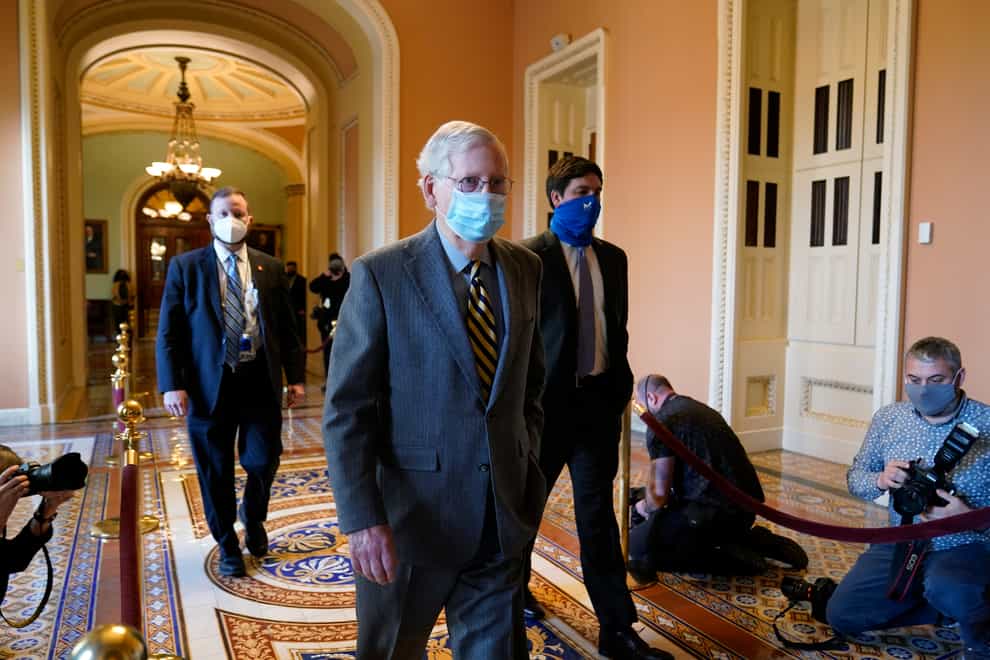 Mitch McConnell walking to his office