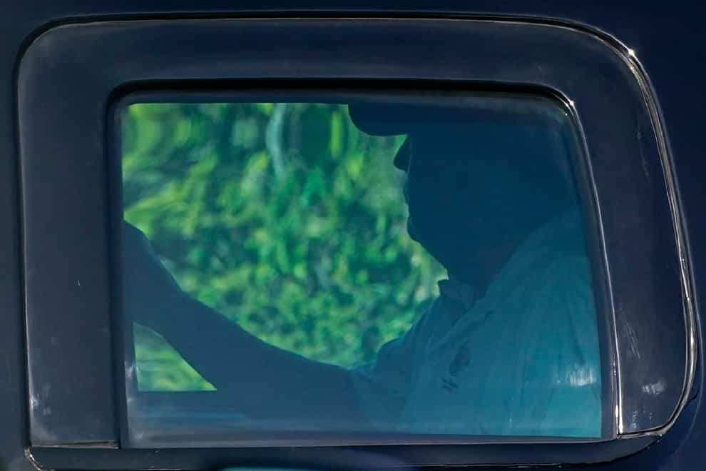 Donald Trump rides in a motorcade vehicle as he departs his Mar-a-Lago resort on Wednesday