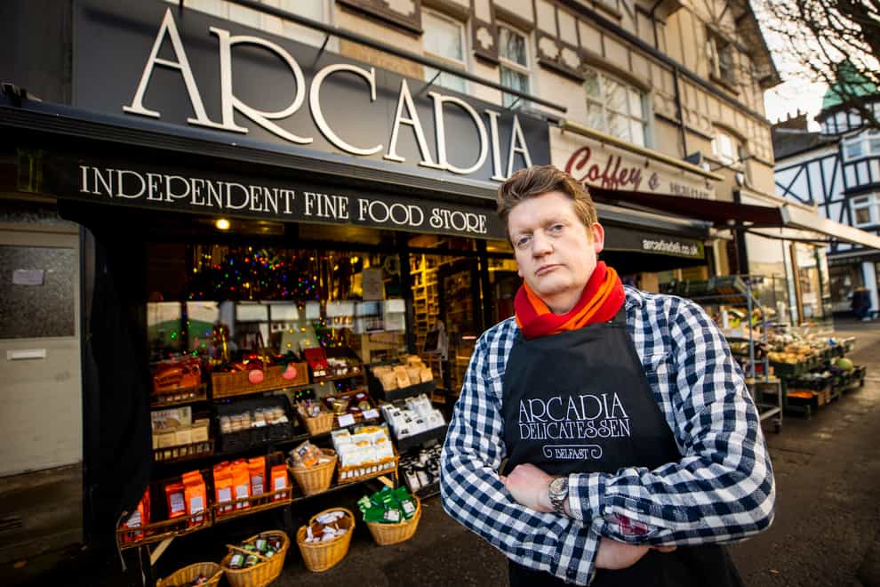 Mark Brown in front of his Arcadia delicatessen