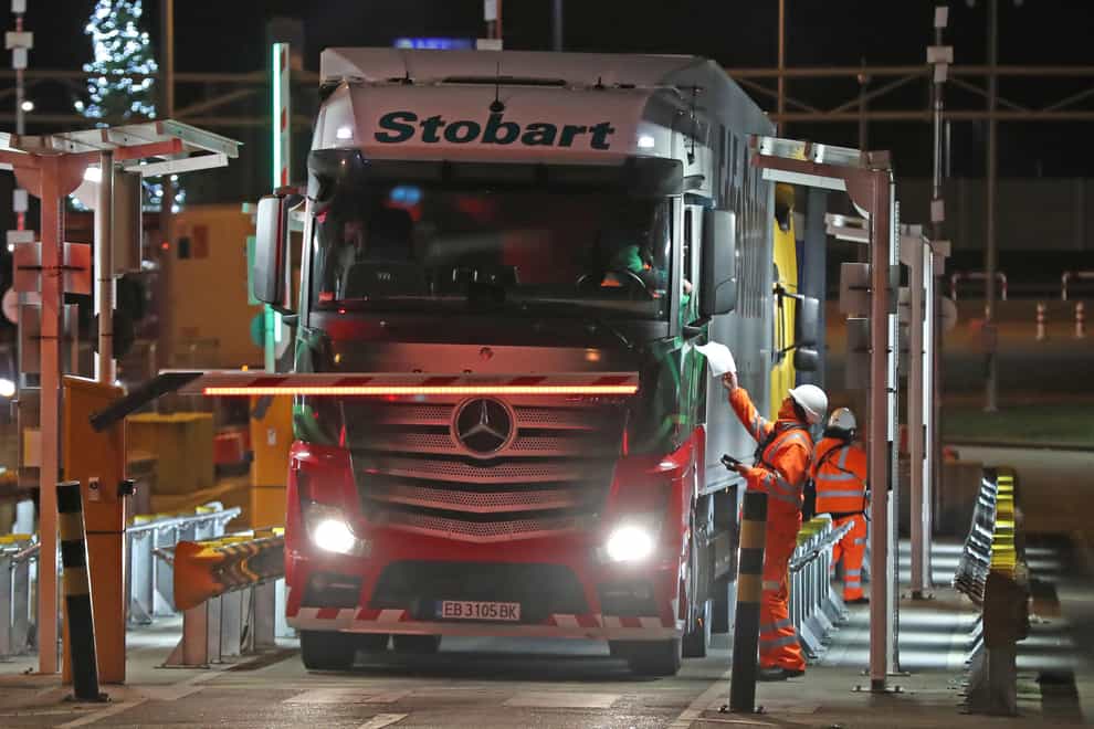 The first lorry, driven by Slavi Ivanov Shumeykov, loads onto Le Shuttle at the Eurotunnel in Folkestone, Kent, after the UK leaves the single market and customs union, and transitional trading arrangements expired at 11pm UK time