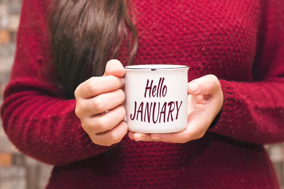 Woman holding a mug saying 'Hello January'