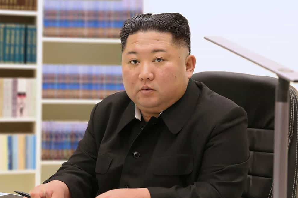 North Korean leader Kim Jong Un writes his New Year card to the public