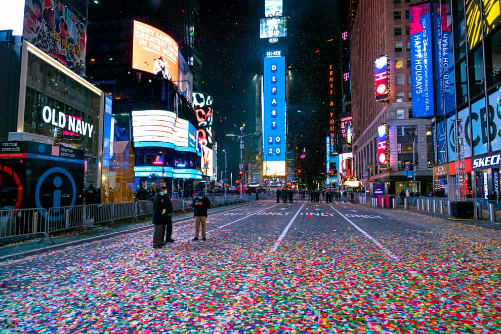 Confetti lies on the street after the New Year’s Eve ball dropped in a nearly empty Times Square in New York early on January 1 2021