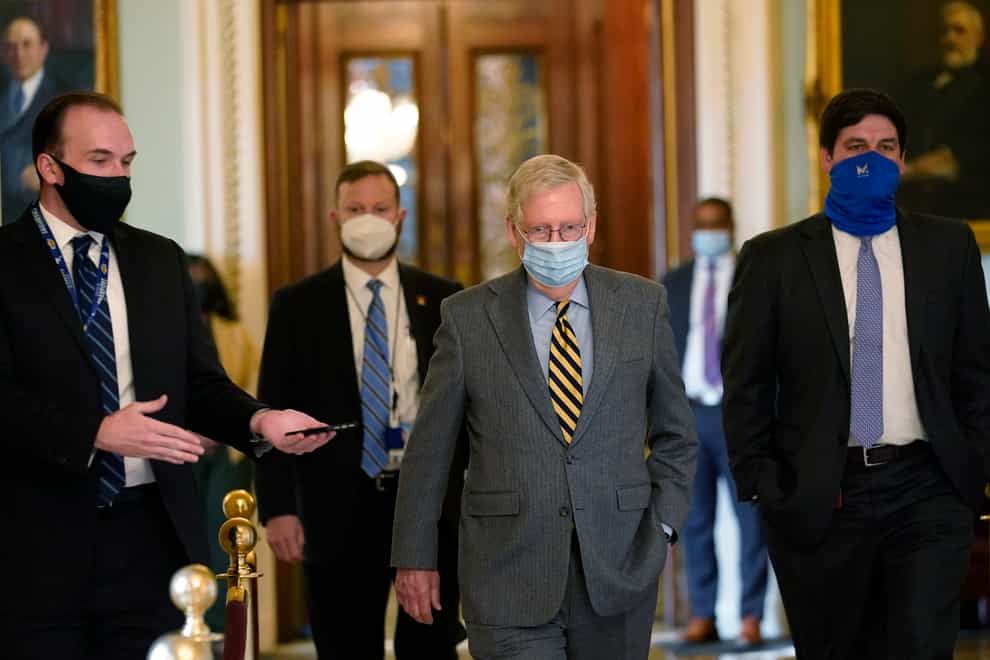 Senate majority leader Mitch McConnell walking out of the Senate