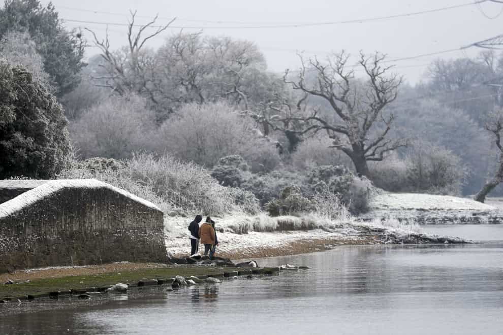 Walkers in the snow and frost in Marchwood, near Southampton