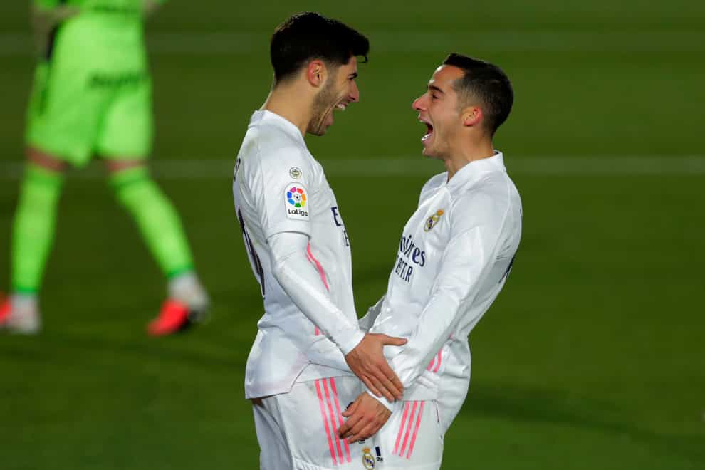 Marco Asensio (left) and Real Madrid team-mate Lucas Vazquez (right) celebrate after a goal