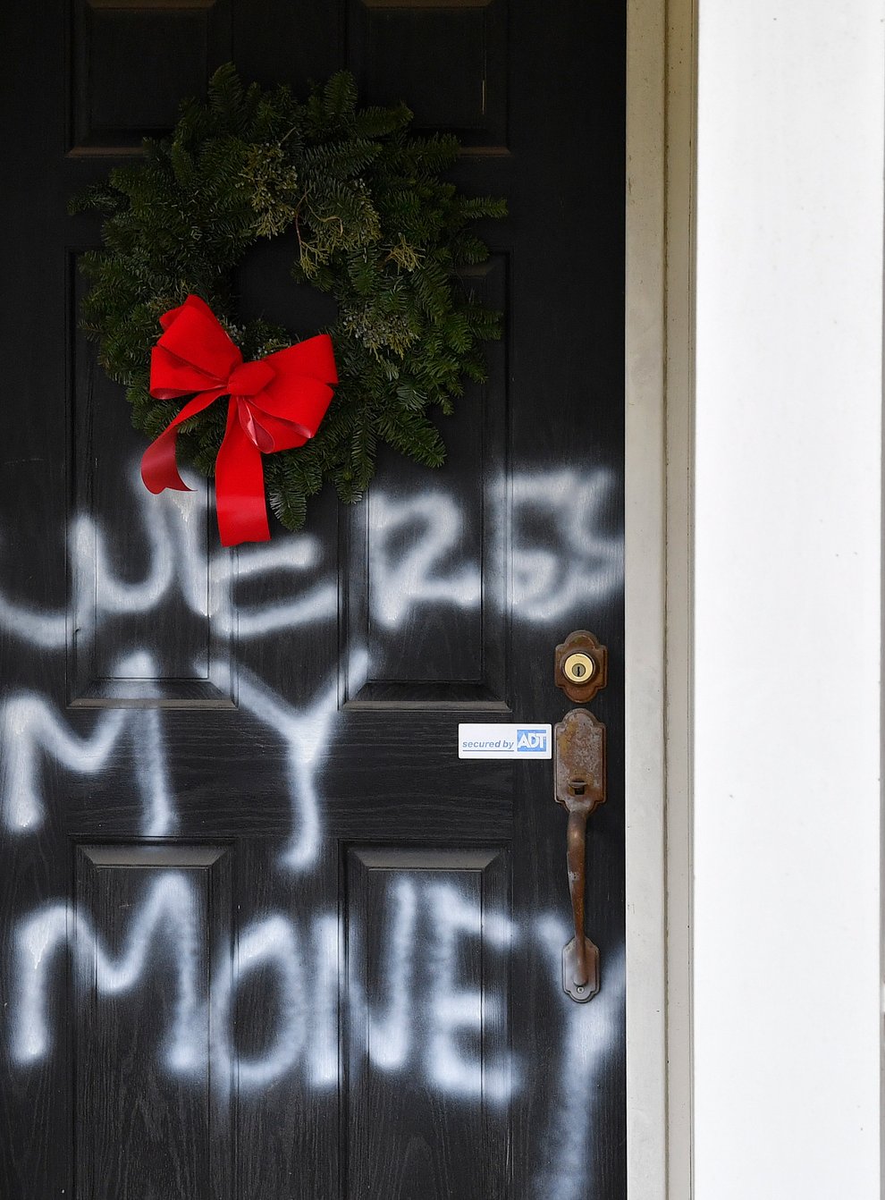 <p>Graffiti at the home of Senate majority leader Mitch McConnell in Louisville, Kentucky (Timothy D Easley/AP)</p>