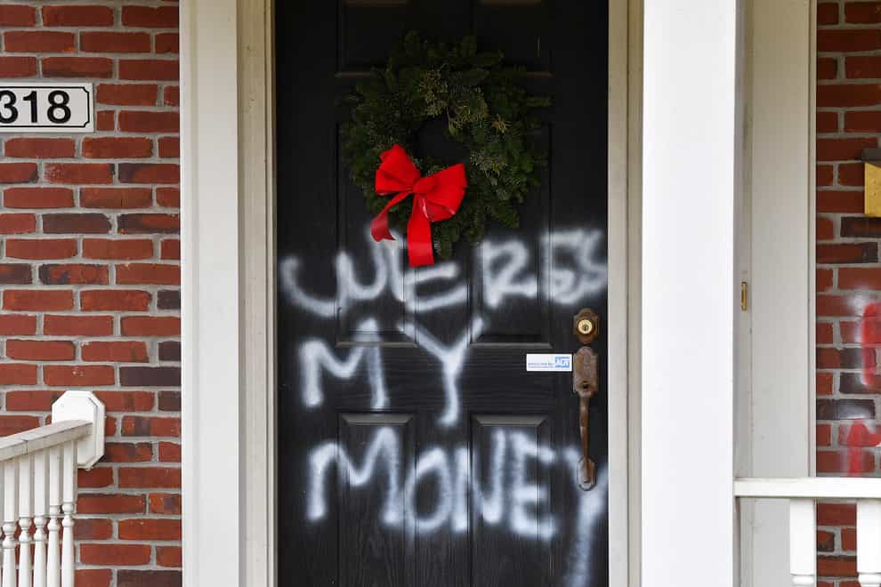 <p>Graffiti at the home of Senate majority leader Mitch McConnell in Louisville, Kentucky (Timothy D Easley/AP)</p>