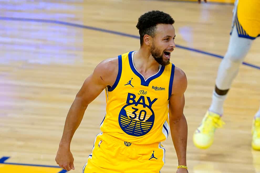 Golden State Warriors guard Steph Curry smiles after scoring 62 points against the Portland Trail Blazers