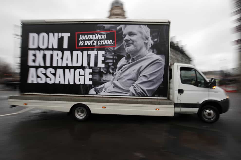 File picture with a van with an advert supporting Julian Assange (Jonathan Brady/PA)