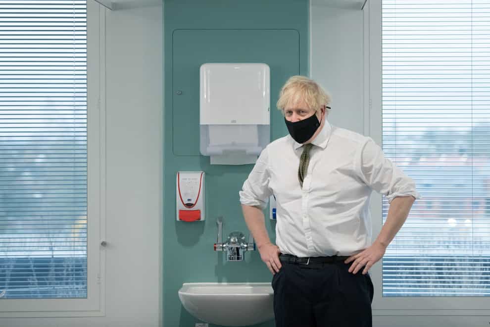Prime Minister Boris Johnson during a visit to view the vaccination programme at Chase Farm Hospital