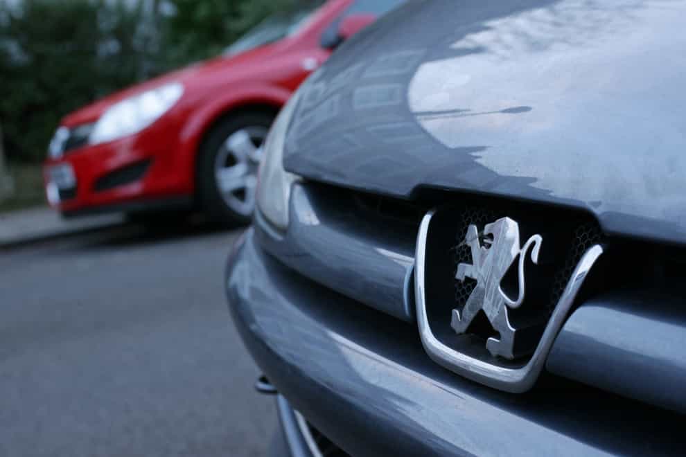 The lion emblem on the front grille of a Peugeot car (Yui Mok/PA)