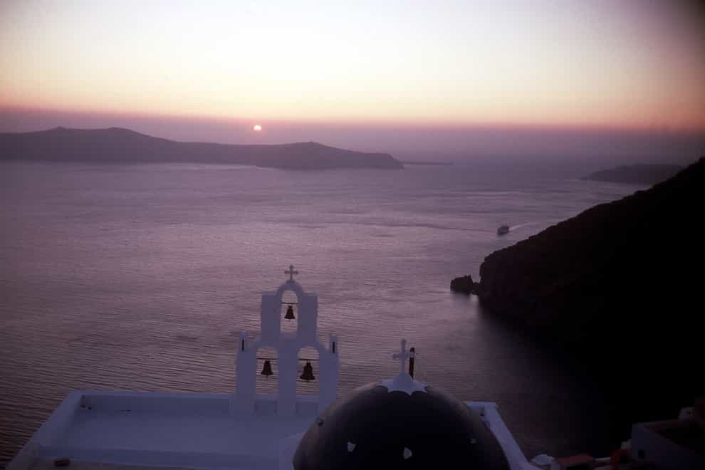 The cupola and bells of an Orthodox church on the Greek island of Santorini (PA)
