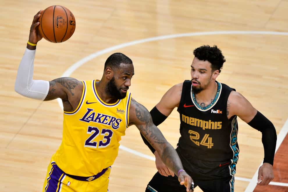 Los Angeles Lakers forward LeBron James handles the ball against Memphis Grizzlies guard Dillon Brooks
