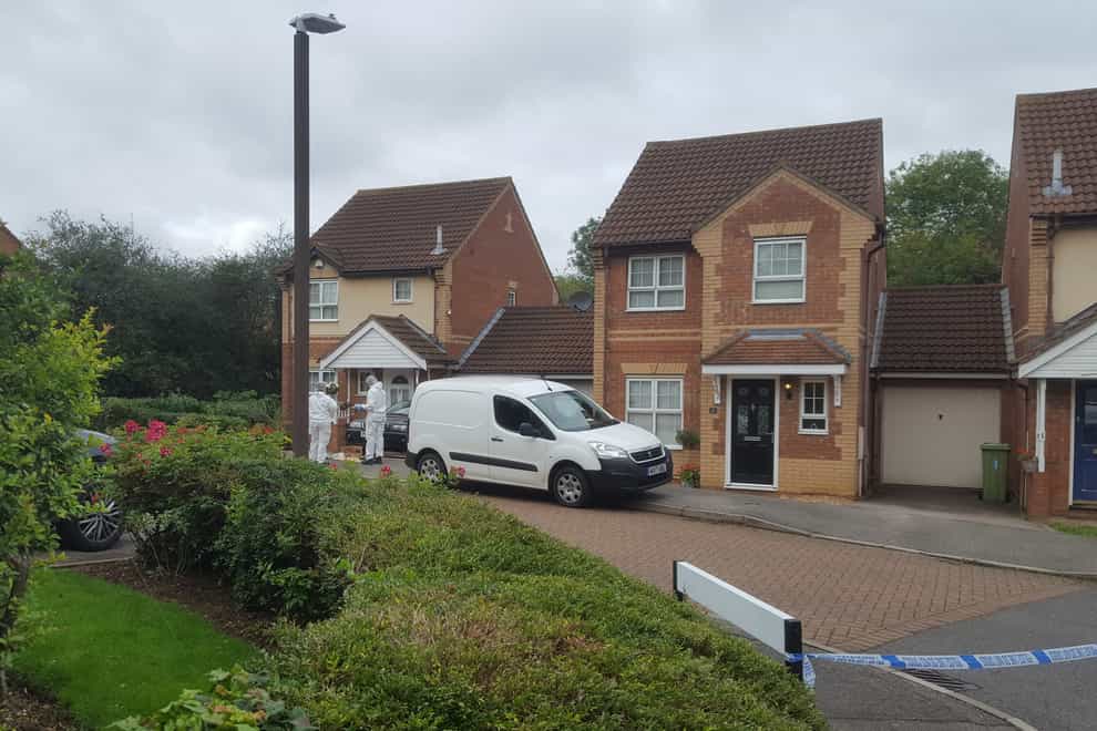 Police at a housing estate in Emerson Valley, Milton Keynes, where two teenage boys were stabbed to death