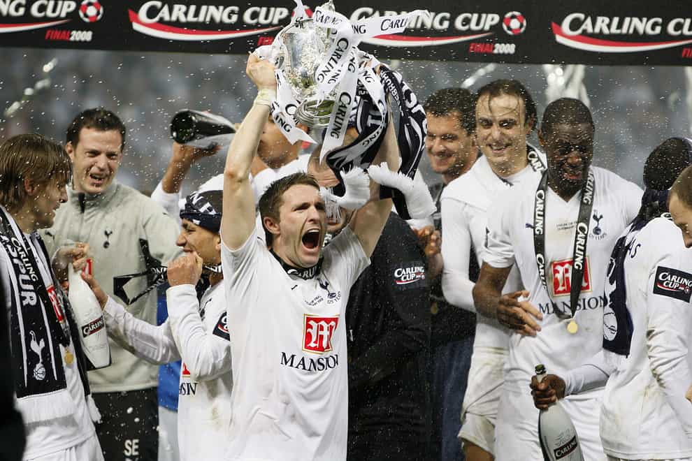 Robbie Keane lifts the League Cup trophy for Tottenham