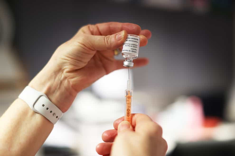 The Oxford vaccine is drawn with a syringe