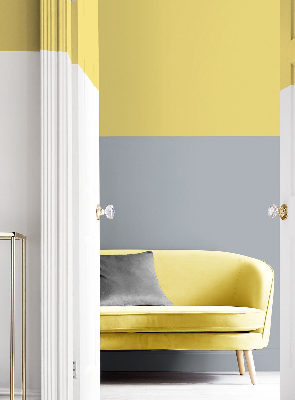A stylish home interior featuring white, yellow and grey paint effects on the walls
