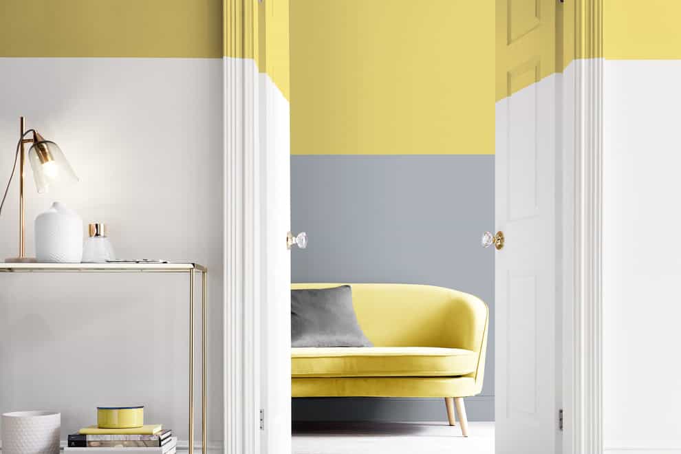 A stylish home interior featuring white, yellow and grey paint effects on the walls