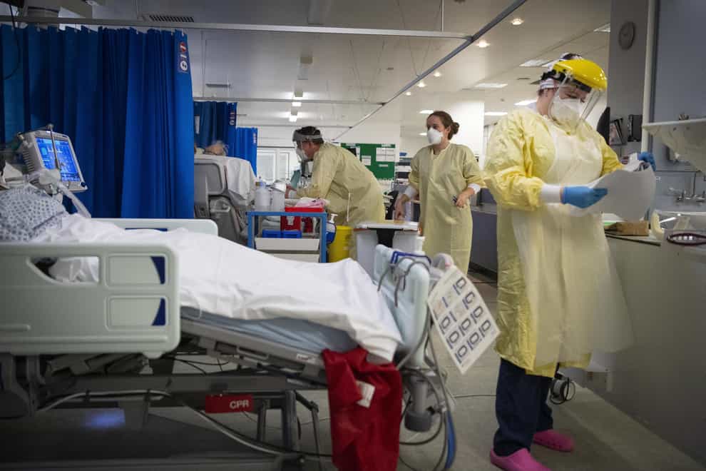 Nurses work on patients in the ICU at St George’s Hospital in Tooting
