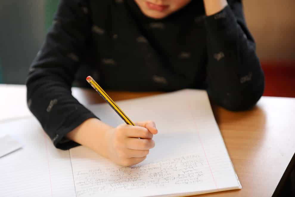 A primary school child doing some writing