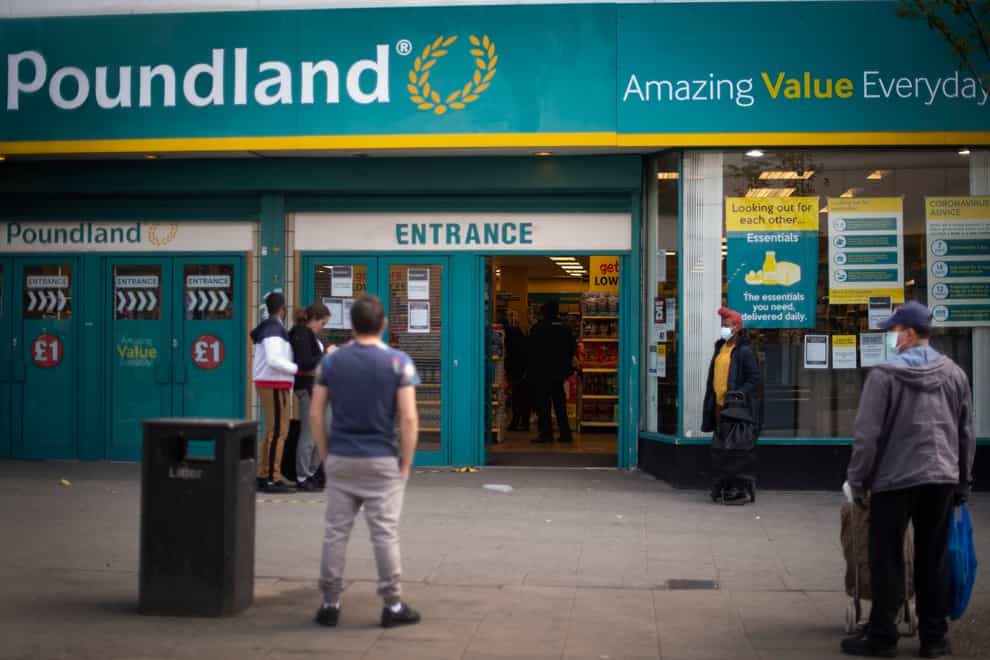 People queue to enter a Poundland shop