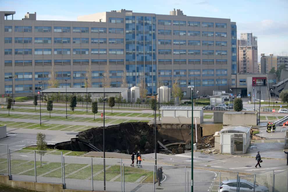 A view of the large sinkhole that opened overnight in the car park of Ospedale del Mare hospital in Naples, Italy (Alessandro Pone/AP)