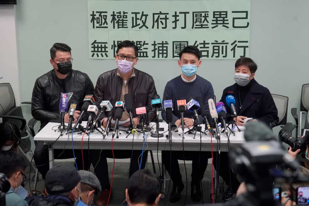 Former Democratic Party legislators Andrew Wan, left, Lam Cheuk-ting, second left, and Helena Wong, right, attend a press conference after being released on bail (KIn Cheung/AP)