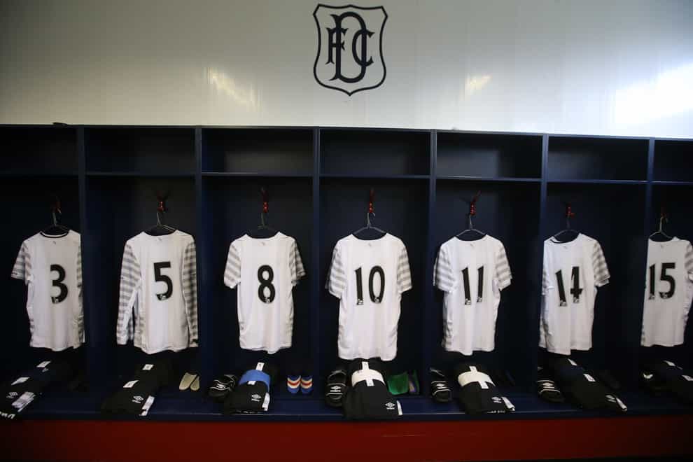 Shirts hung up in a dressing room