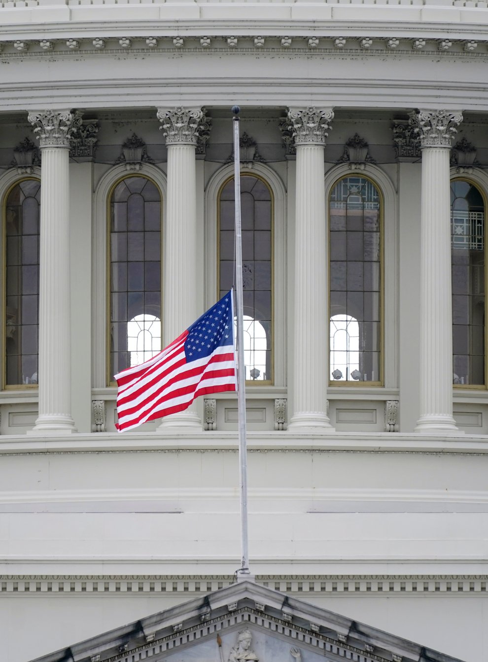 A US flag flies at half-mast in remembrance of US Capitol Police Officer Brian Sicknick (Patrick Semansky/AP)