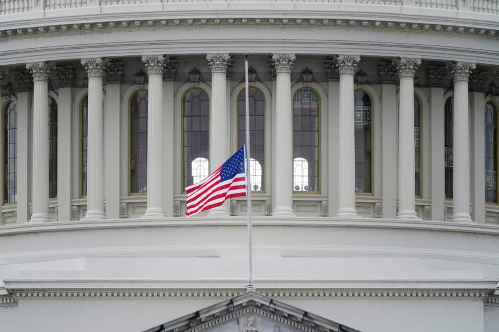 A US flag flies at half-mast in remembrance of US Capitol Police Officer Brian Sicknick (Patrick Semansky/AP)