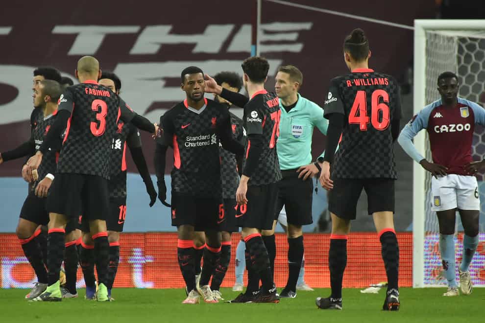 Liverpool’s Georginio Wijnaldum celebrates with his team-mates