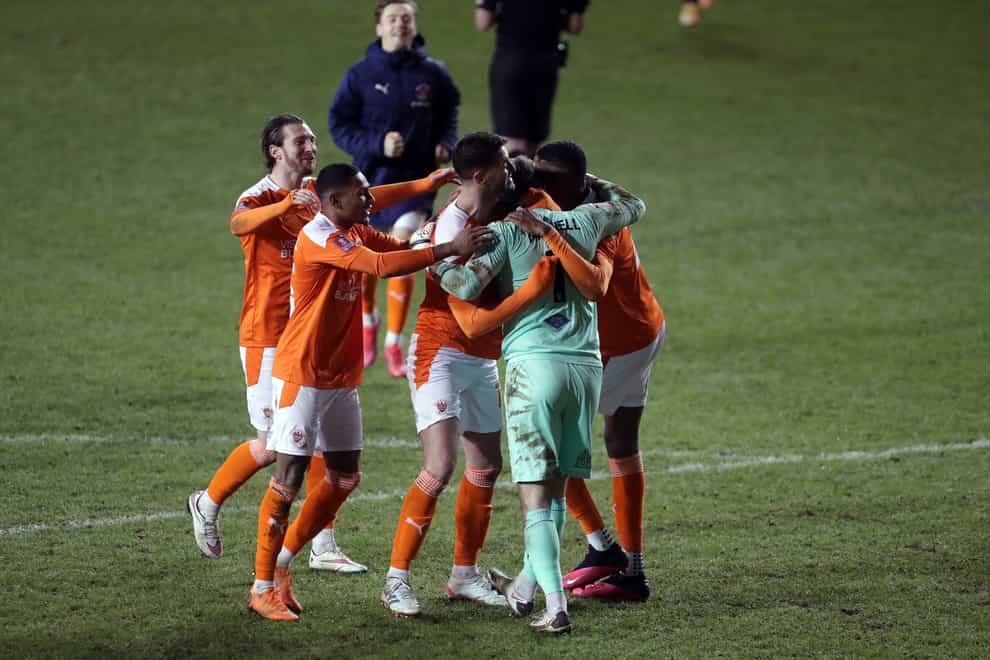 Blackpool goalkeeper Chris Maxwell celebrates with his team-mates after the shootout