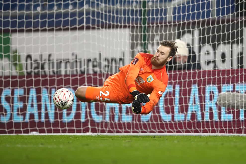 Will Norris saves from Lasse Sorensen in the penalty shoot-out