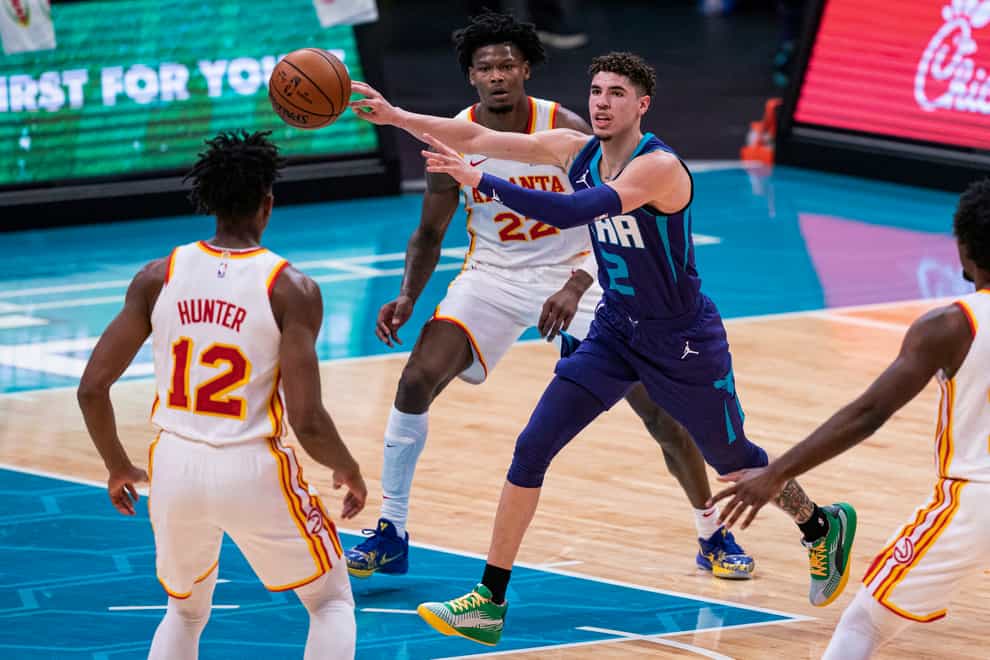 Charlotte Hornets guard LaMelo Ball passing the ball
