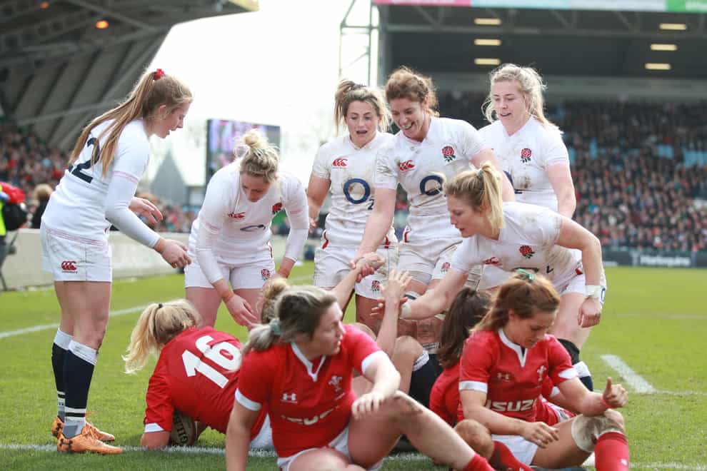 England’s players celebrate a try