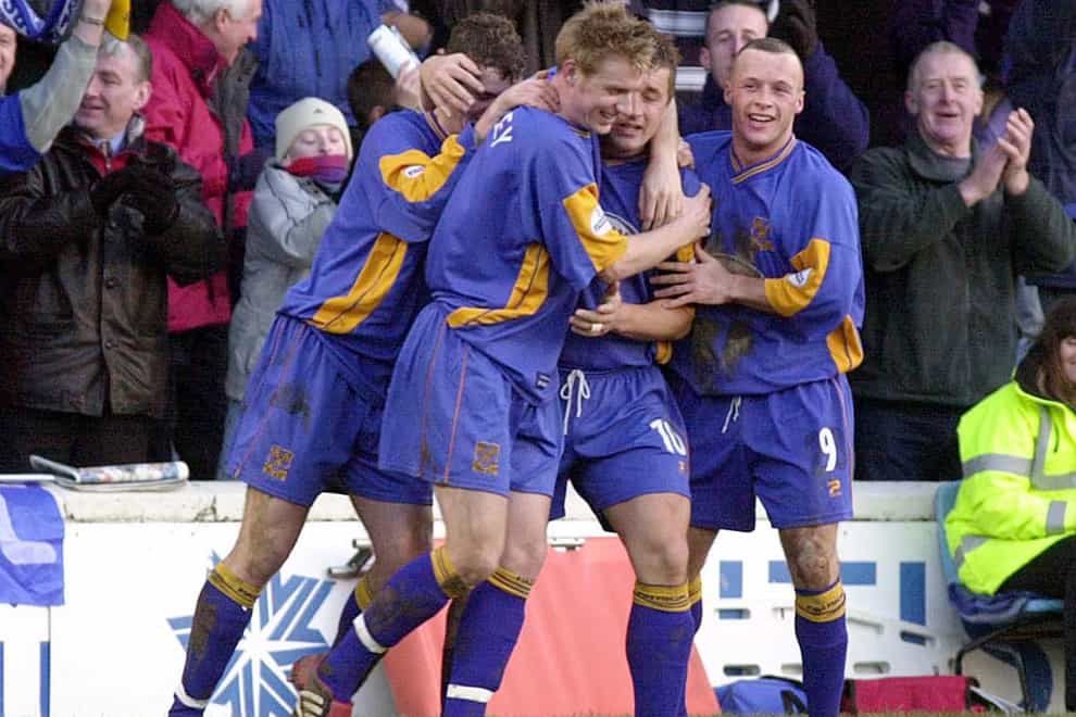Shrewsbury’s Nigel Jemson (number 10) is mobbed by team-mates after scoring against Everton in 2003