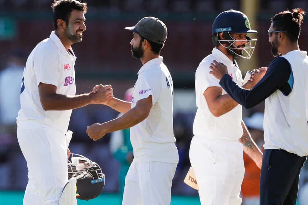 India celebrate after holding Australia to a draw in the third Test