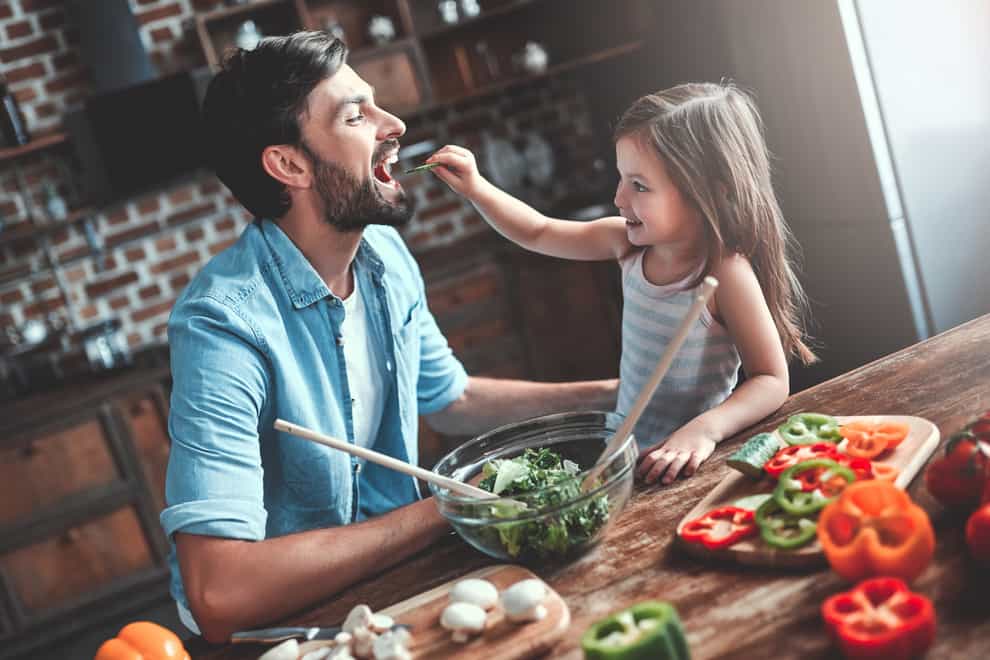 A Generic Photo of dad and daughter eating veg. See PA Feature TOPICAL Food Veg. Picture credit should read: iStock/PA. WARNING: This picture must only be used to accompany PA Feature TOPICAL Food Veg.