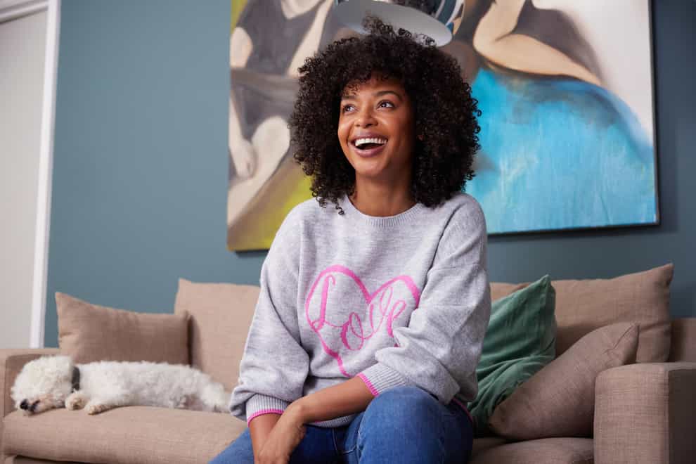 Smiling black woman wearing a Wallis Grey Love Slogan Jumper